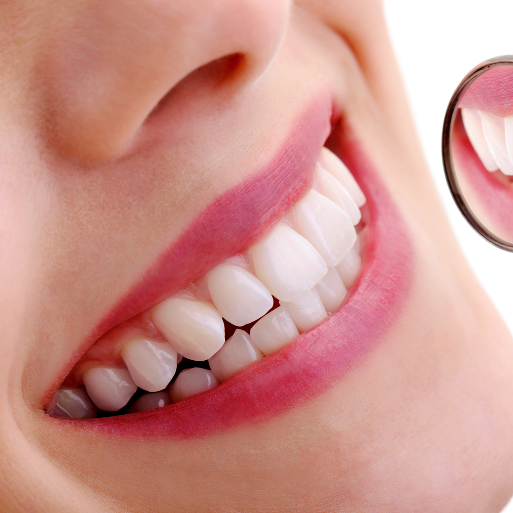 Beautiful Smile With Dental Mirror