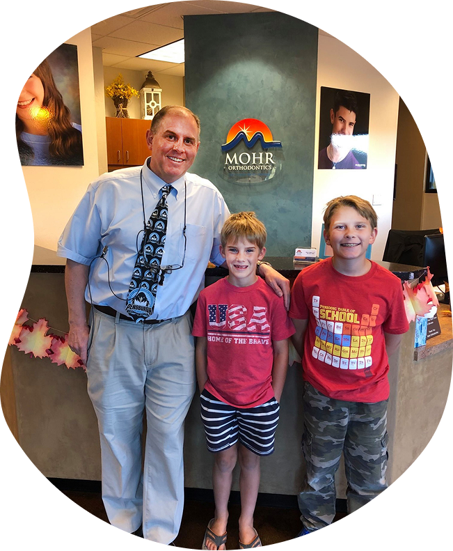 Dr Mohr With Two Smiling Orthodontic Patients