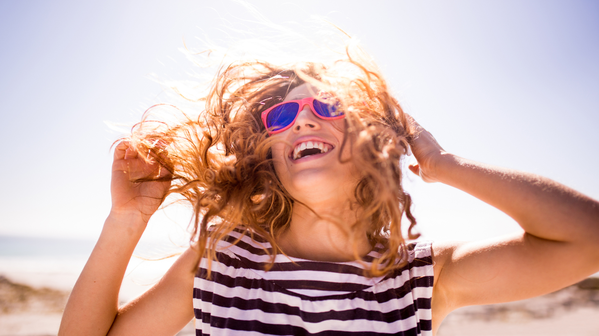 Cheerful Laughing Woman On The Beach