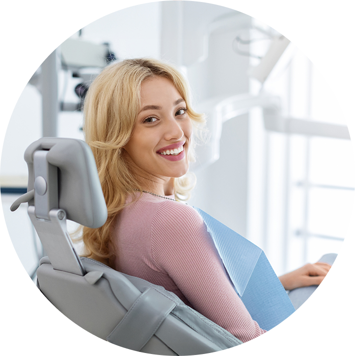 Smiling Woman Sitting In Orthodontist Chair