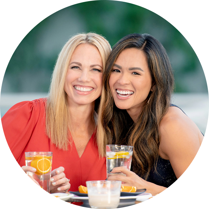 Two Smiling Women Wearing Braces Having Drinks Outdoors