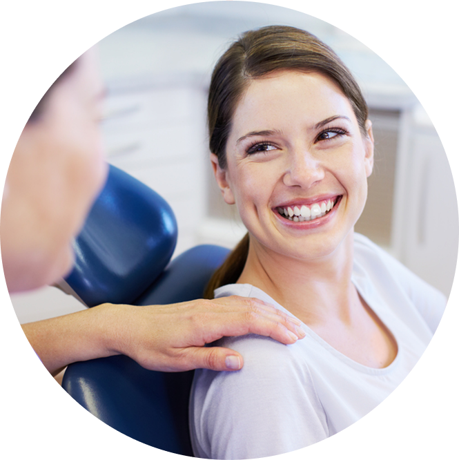 Woman In Office Smiling Up At Orthodontist